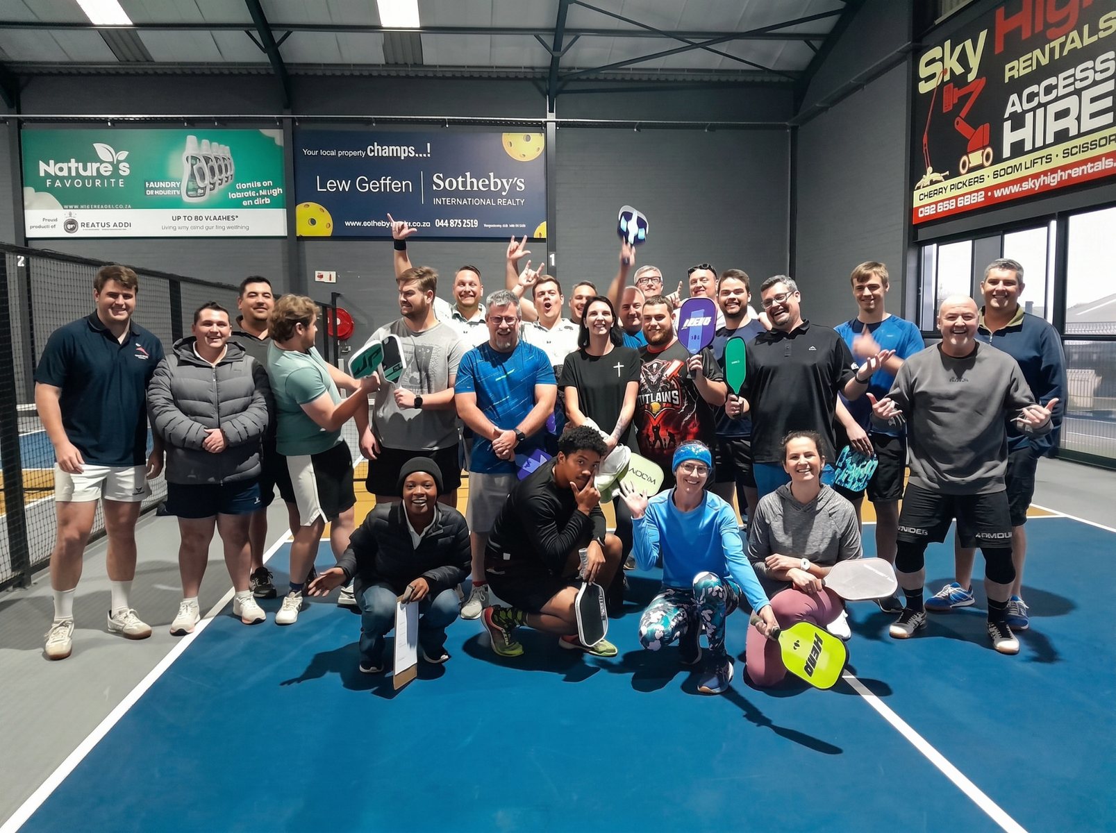A group enjoying a pickleball event at Pickleball George