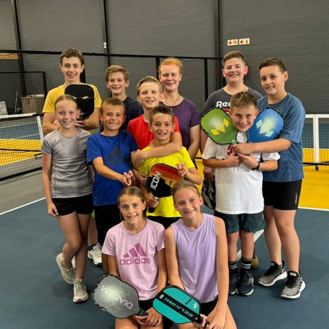 Young players enjoying a group pickleball event